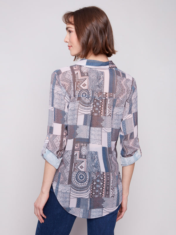 Blouse showcasing adjustable roll-up sleeves and semi-sheer fabric, adding versatility to your wardrobe by Charlie B.