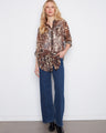 Elegant shirt with a classic collar, featuring a semi-sheer fabric and chest pockets for added style by Charlie B.