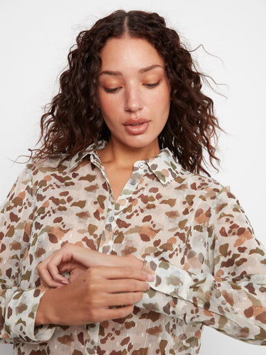 The semi-sheer fabric of this top offers an elegant and airy feel, making it ideal for layering or wearing alone by Charlie B.