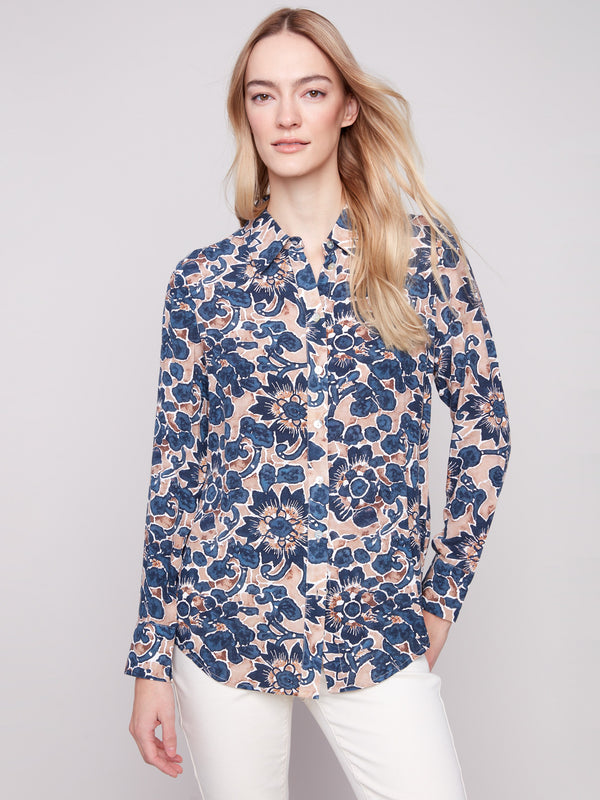 Long sleeve shirt with intricate floral patterns in blue and cream shades, featuring button-down design and foldable cuffs by Charlie B.