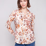 Long sleeve shirt with intricate geometric patterns in brown and cream shades, featuring button-down design and foldable cuffs by Charlie B.