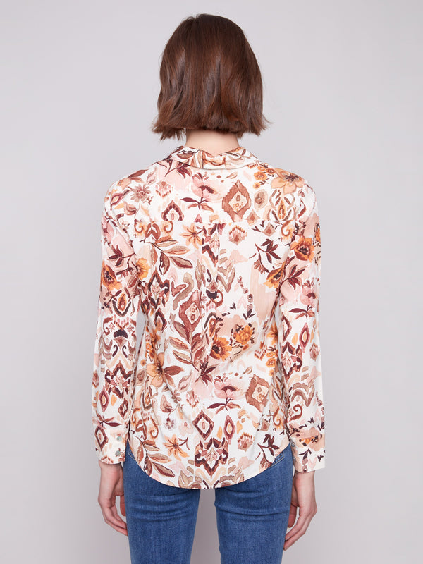 Long sleeve shirt with intricate geometric patterns in brown and cream shades, featuring button-down design and foldable cuffs by Charlie B.