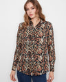 This shirt features a classic collar and an intricate pattern, perfect for adding elegance to your wardrobe. By Charlie B.