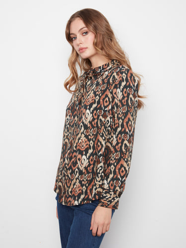 The button-front closure on this shirt provides easy wearability while maintaining a stylish look. By Charlie B.