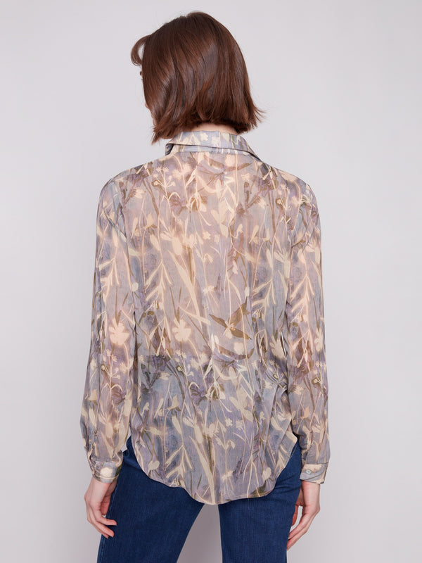 Elegant floral design on semi-sheer fabric creates a timeless look in this blouse by Charlie B.
