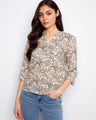 Floral blouse with a stylish chest pocket, perfect for casual outings. Designed by Charlie B.