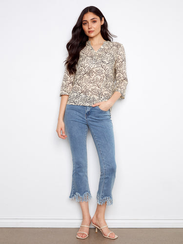 Elegant floral top featuring a chic Henley neckline, adding sophistication to your look. By Charlie B.