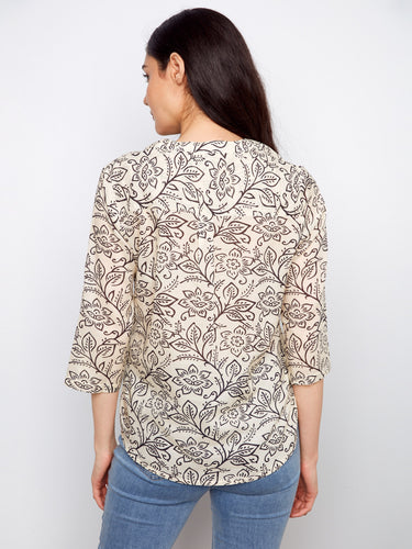 Beautifully patterned blouse with adjustable roll-up sleeves for added comfort and style. By Charlie B.