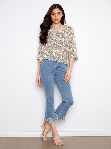 Stylish floral printed top that combines elegance and comfort in one piece. Created by Charlie B.