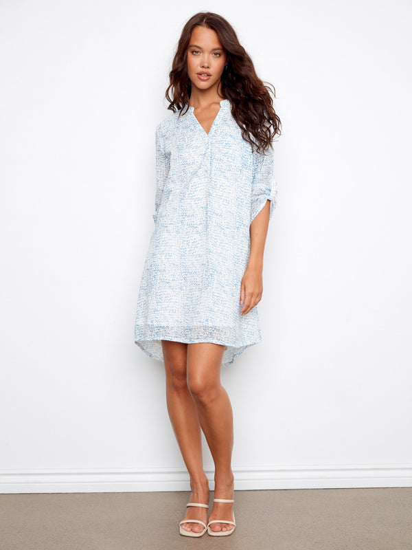Henley shirt dress in light blue with an adjustable 3/4 sleeve design, perfect for versatile styling by Charlie B.