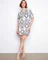 The dress features a chic chest pocket, adding both style and functionality to the overall design by Charlie B.