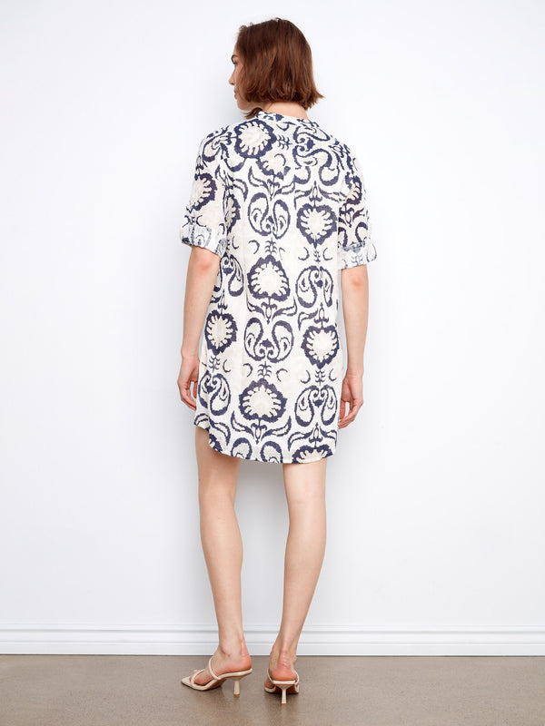 The high-low hem adds a modern twist to the knee-length silhouette of this fashionable dress by Charlie B.