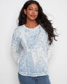 Floral patterned sweater made from 100% cotton, featuring a crew neckline for a classic look. By Charlie B.