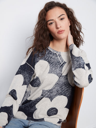 Chic navy graphic print sweater with drop shoulders and a cozy rounded hem, ensuring comfort all day by Charlie B.