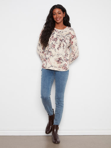 Embrace style with this floral top showcasing drop shoulders and long sleeves, ideal for any season. by Charlie B.