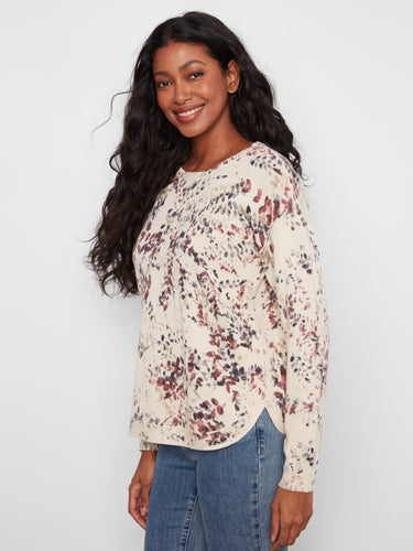 Lovely floral print top with a rounded hem adds a touch of elegance to your everyday look, perfect for layering. by Charlie B.