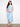 Stylish dress with a faux knot detail, adding elegance to the blue geometric pattern. Crafted in 100% cotton by Charlie B.