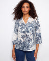 Floral print Henley blouse featuring a chest pocket and adjustable roll-up sleeves, perfect for versatile styling by Charlie B.