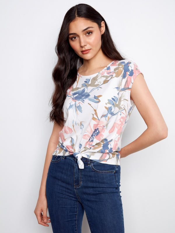 Floral printed top with a crew neckline and cap sleeves, offering a chic touch to any outfit by Charlie B.