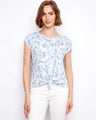 Blue and white floral top featuring a stylish front tie knot at the hem, adding a chic touch to any casual outfit by Charlie B.