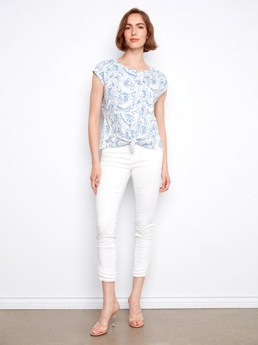Elegant cap sleeves enhance the relaxed fit of this blue and white floral top, perfect for warm weather styling by Charlie B.