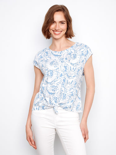 Crafted from 100% cotton, this blue and white floral top offers breathability and comfort for all-day wear by Charlie B.