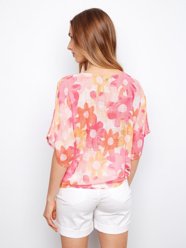 Printed blouse in airy fabric, styled effortlessly with casual white pants by Charlie B.