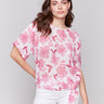 Floral blouse featuring a crew neck by Charlie B.
