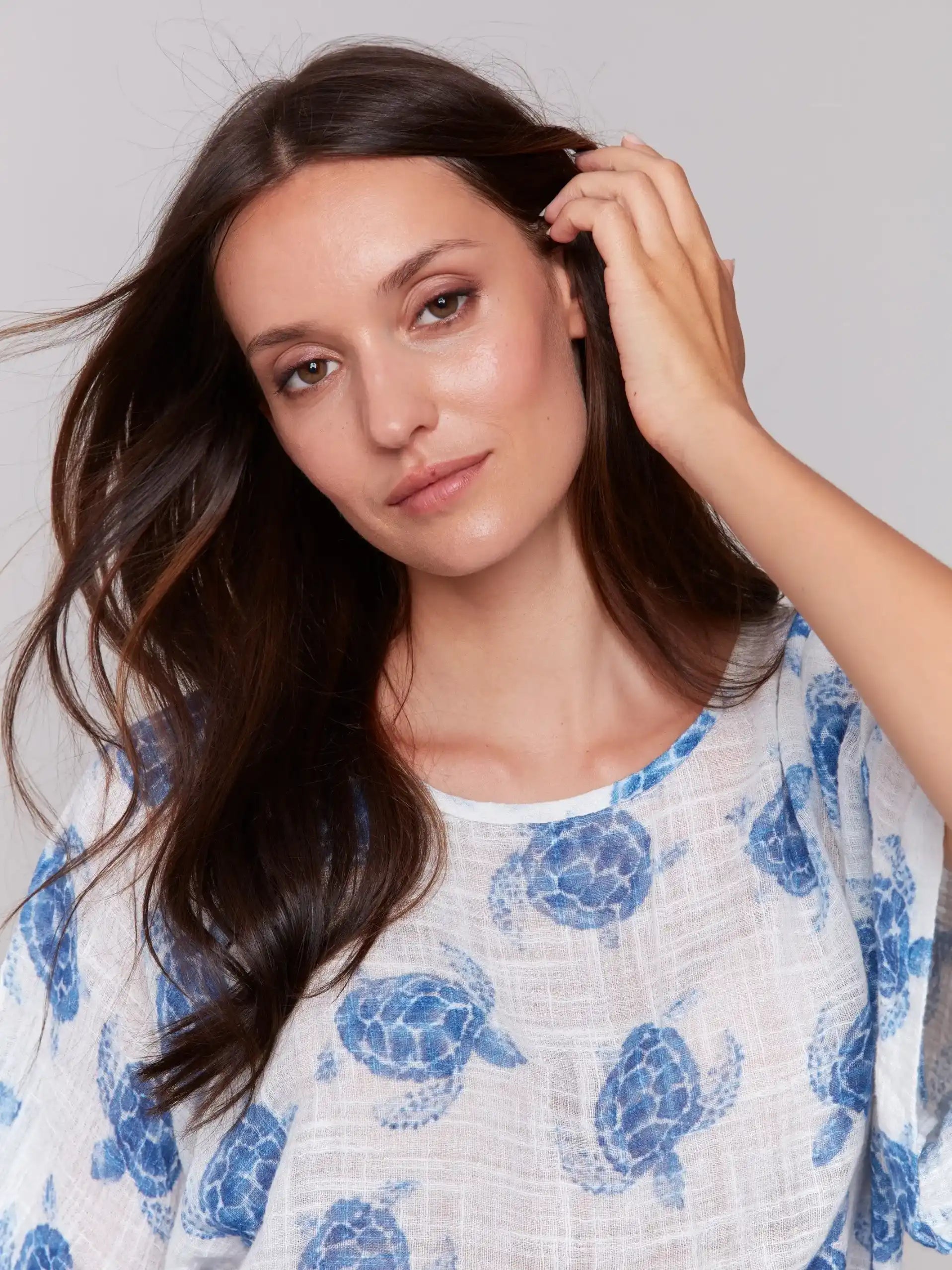 Fashionable crew neck design with turtle pattern by Charlie B.