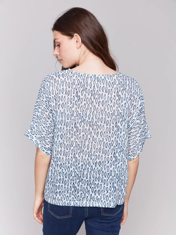 Short dolman sleeve blouse featuring fish patterns by Charlie B.