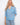 Blue patterned blouse featuring a convenient chest pocket, paired with light jeans for a casual look by Charlie B.
