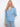 Blue patterned blouse featuring a convenient chest pocket, paired with light jeans for a casual look by Charlie B.