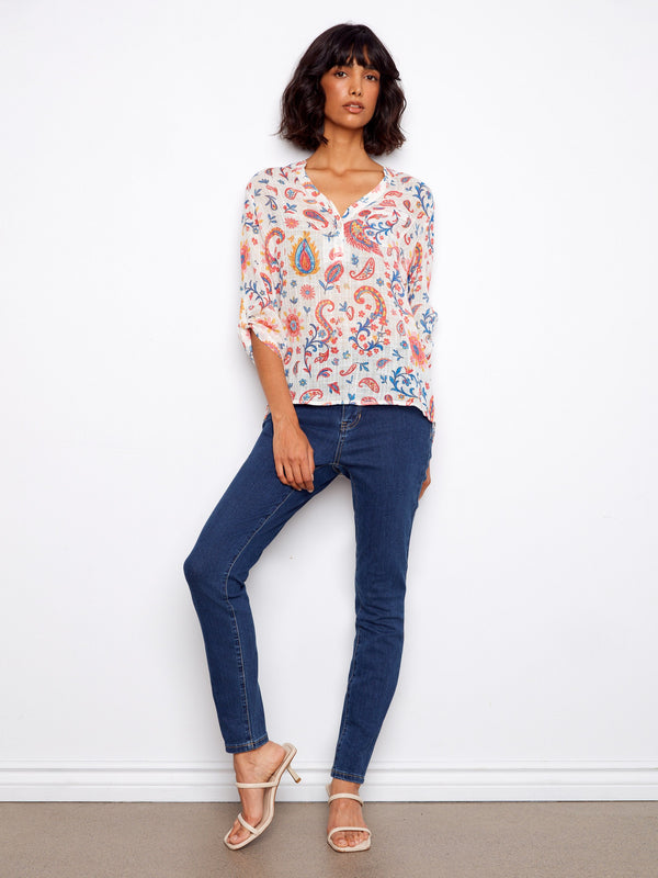 Chic half-button design on a colorful blouse, perfect for casual outings or dressing up with accessories by Charlie B.