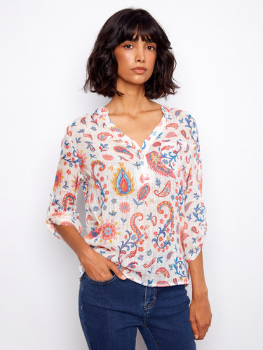 Stylish blouse featuring a chest pocket that blends seamlessly into the intricate floral pattern by Charlie B.