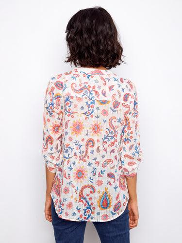 Back view of the floral blouse highlighting its seamless design and vibrant color palette by Charlie B.