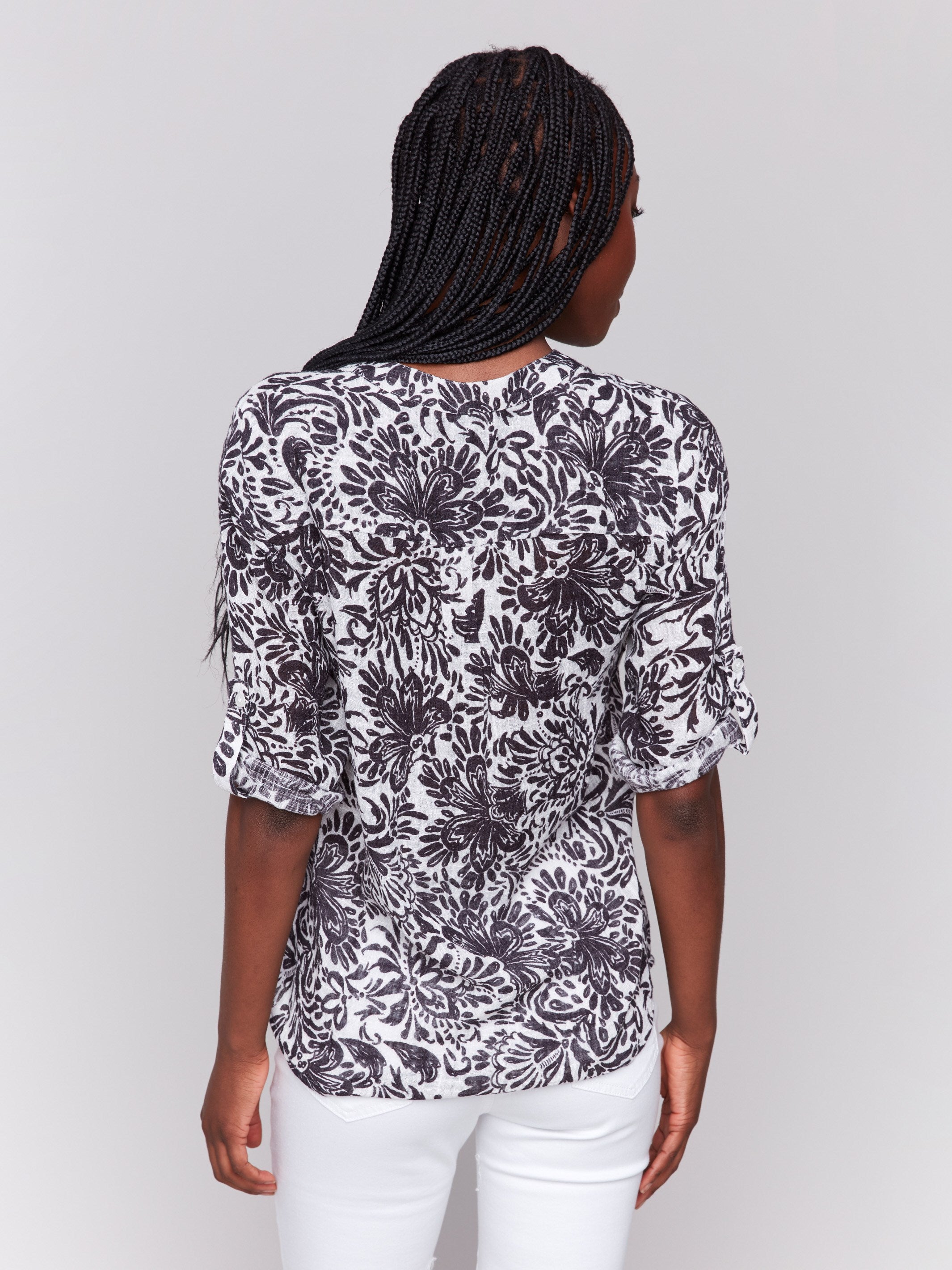 Floral print blouse with half-button front and chest pocket in pepper shade by Charlie B.