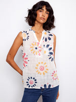 Floral top with a stylish Henley neckline and vibrant print, perfect for summer outings. Designed with comfort in mind by Charlie B.