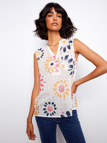 Lightweight sleeveless blouse adorned with colorful flowers, offering both elegance and comfort by Charlie B.