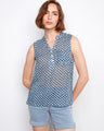 Blouse with a Henley neckline and geometric print, featuring a half-button front for added style by Charlie B.