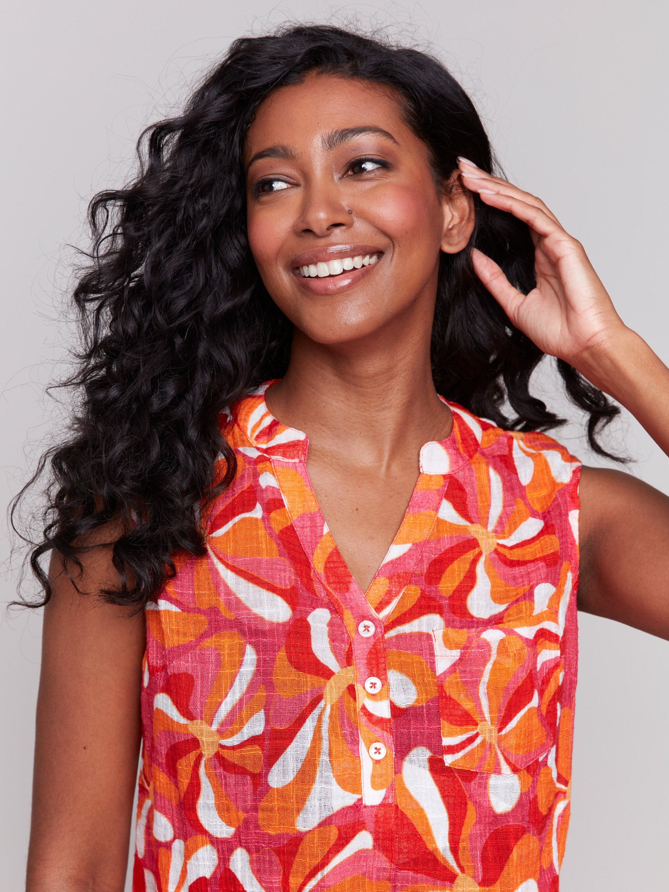 High-low hem sleeveless top with a groovy pattern and V-neck by Charlie B.