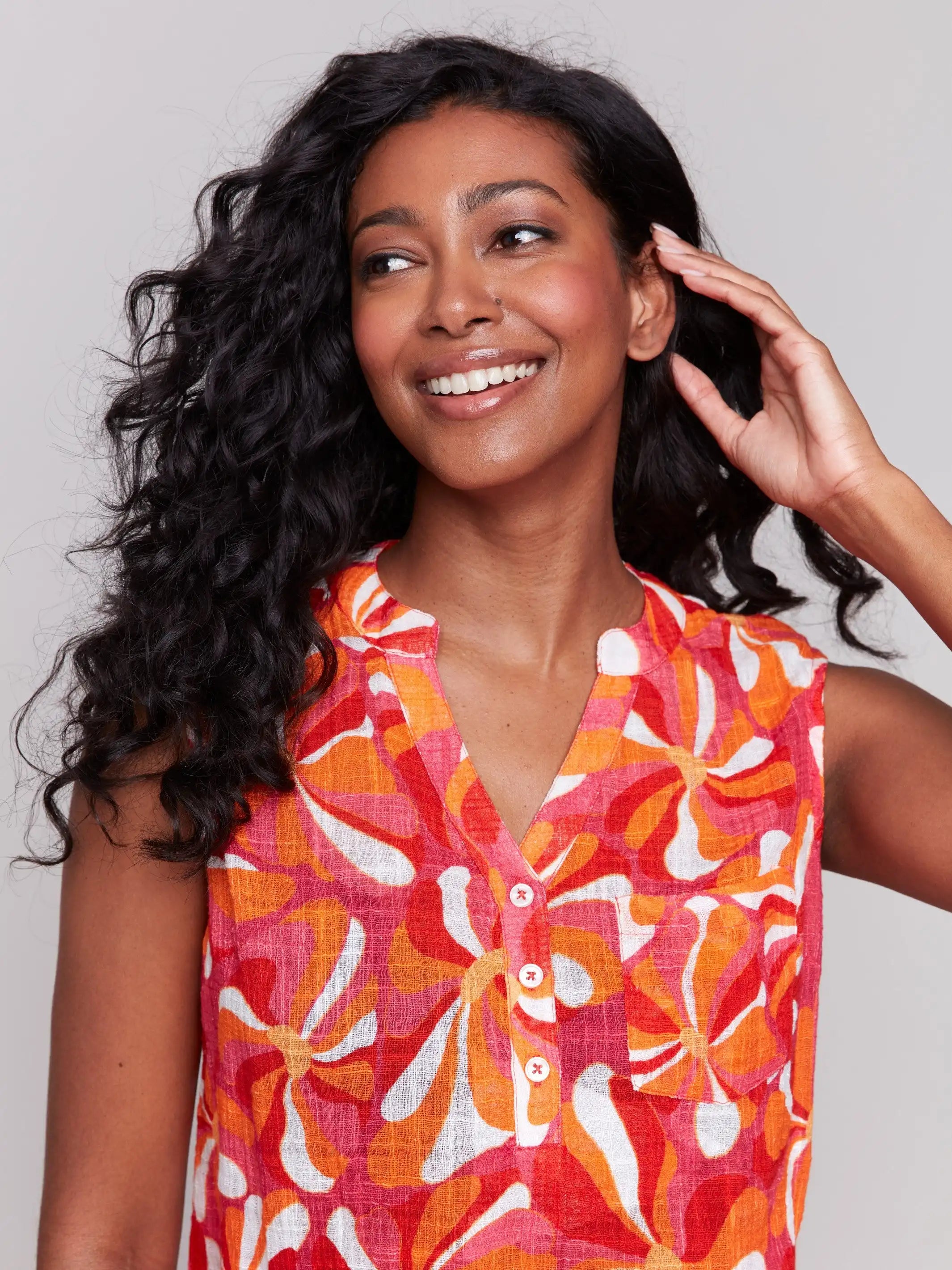 High-low hem sleeveless top with a groovy pattern and V-neck by Charlie B.