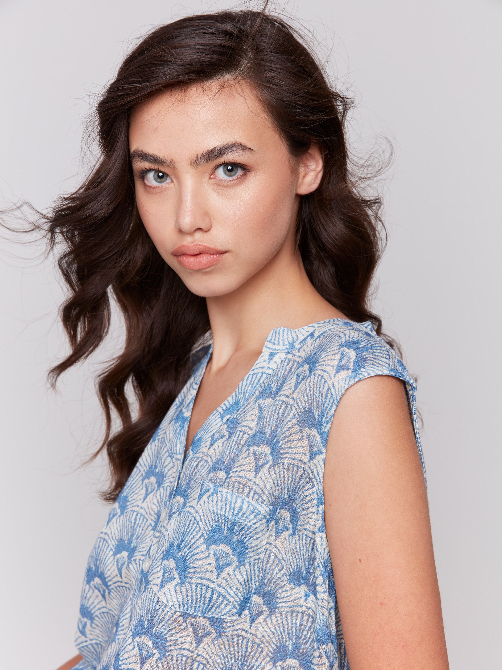 Sleeveless top with high-low hem in a unique tapestry print by Charlie B.