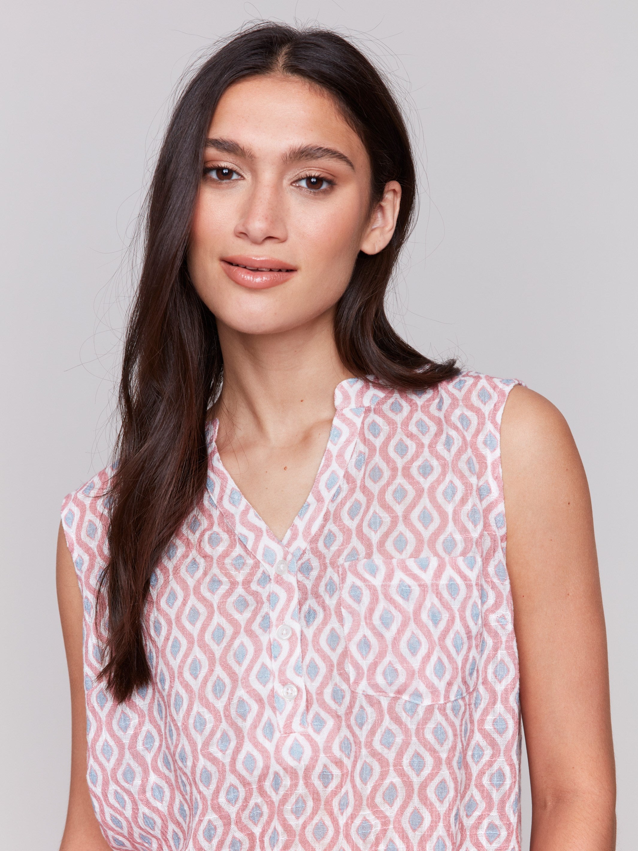 High low hem adds flair to this sleeveless cotton gauze top by Charlie B.