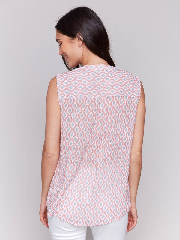 Geometric pattern enhances the elegance of this sleeveless high-low hem top by Charlie B.