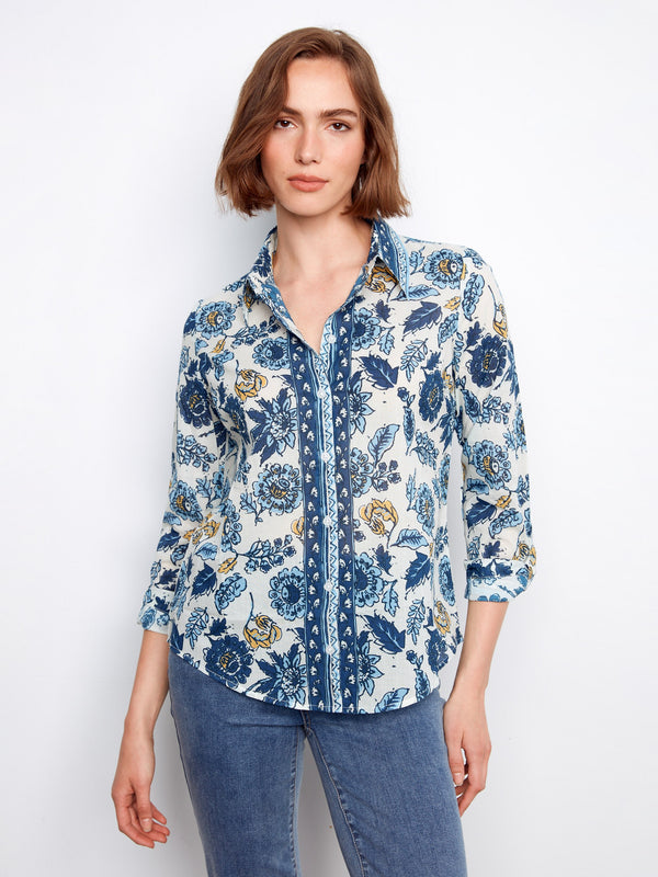 Floral shirt featuring a classic button-up closure, perfect for casual outings. The design adds elegance to any wardrobe by Charlie B.