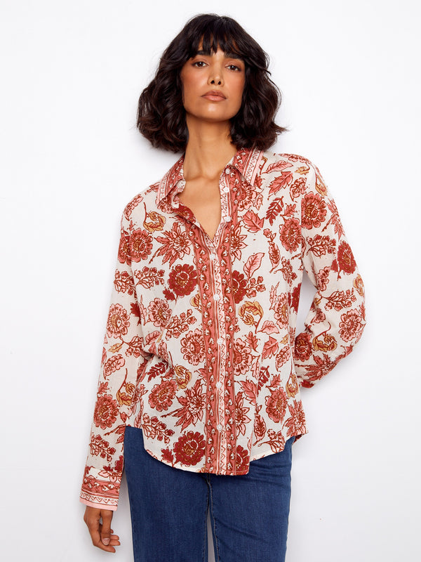 Cotton voile blouse adorned with floral prints and a sleek button-up design for effortless elegance by Charlie B.