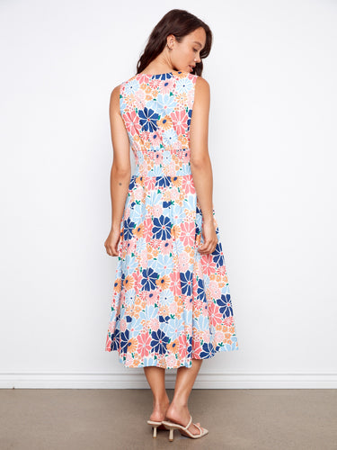 Experience the practicality of hidden pockets in this lovely floral midi dress, combining style and utility by Charlie B.
