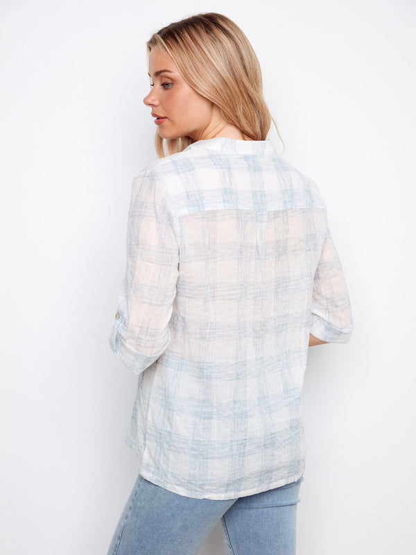 Casual plaid blouse with adjustable sleeves and Henley neckline for a relaxed yet chic look by Charlie B.