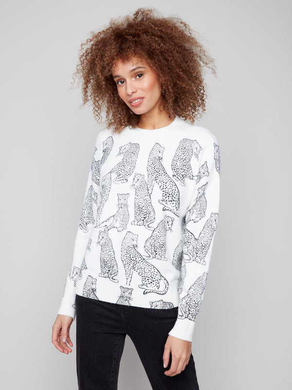Stylish white sweater adorned with black cheetah print, highlighted by its comfortable crew neck by Charlie B.