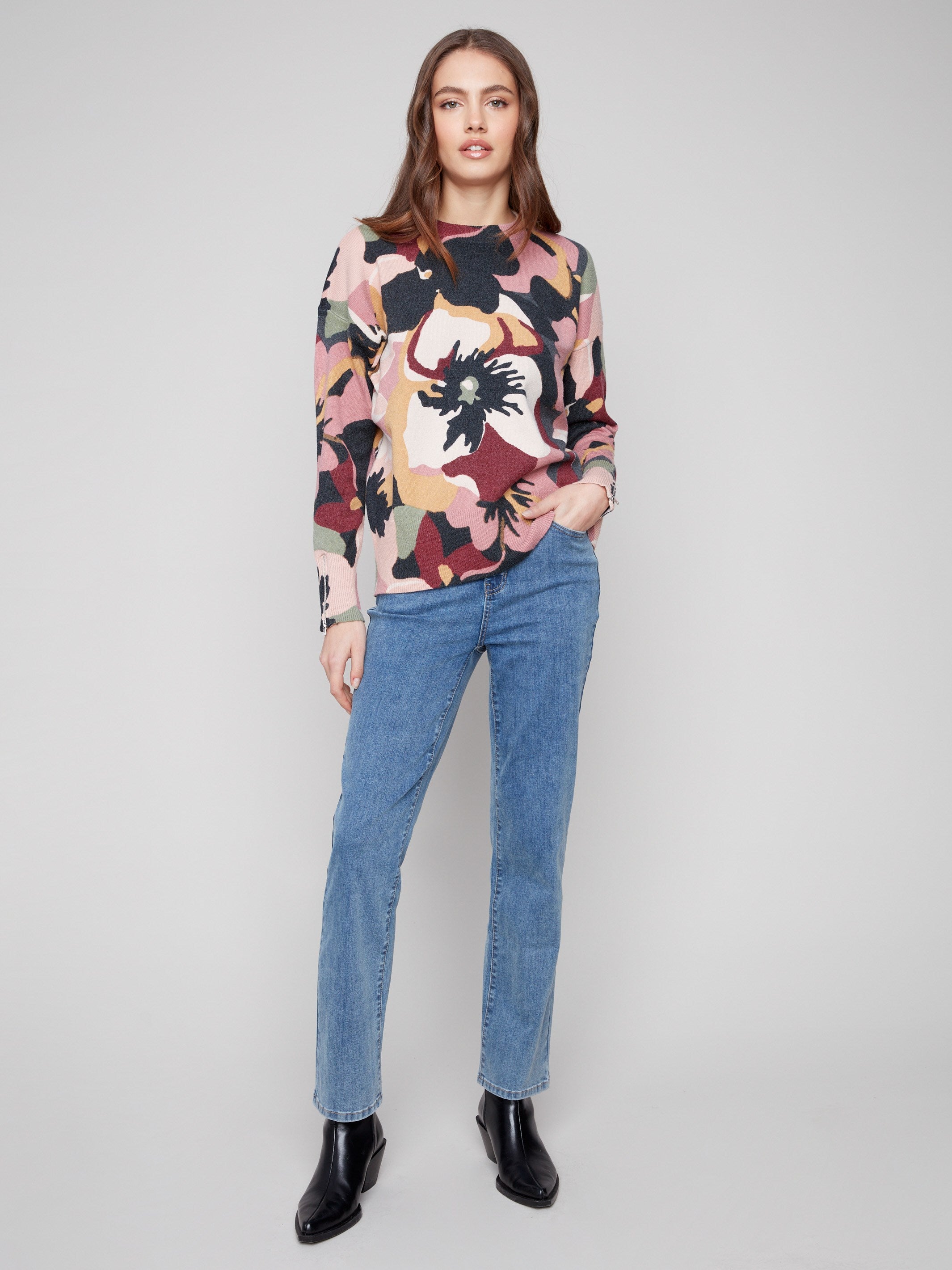 Long-sleeved sweater adorned with bold floral motifs, adding flair to any outfit by Charlie B.